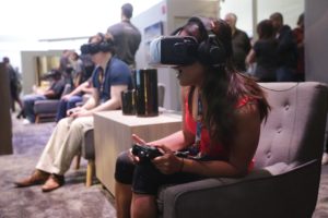 People try out the Oculus Rift virtual reality headsets at the Oculus booth at the Electronic Entertainment Expo on Wednesday, June 11, 2014, in Los Angeles. (AP Photo/Jae C. Hong)