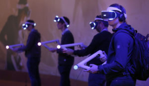 PARIS, FRANCE - OCTOBER 26:  Visitors play the game "Farpoint" with the virtual reality head-mounted 'Playstation VR' developed by Sony Interactive Entertainment during the "Paris Games Week" on October 26, 2016 in Paris, France. "Paris Games Week" is an international trade fair for video games to be held from October 26 to October 31, 2016.  (Photo by Chesnot/Getty Images)