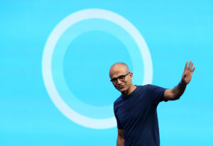 SAN FRANCISCO, CA - APRIL 02:  Microsoft CEO Satya Nadella walks in front of the new Cortana logo as he delivers a keynote address during the 2014 Microsoft Build developer conference on April 2, 2014 in San Francisco, California. Satya Nadella delivered the opening keynote to kick off the 2014 Microsoft Build developer conference which runs through April 4.  (Photo by Justin Sullivan/Getty Images)