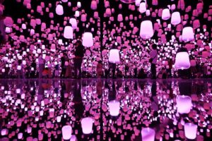 TOPSHOT - This picture taken on April 28, 2019 shows people enjoying their visit at the team lab borderless museum of Tokyo. - Collective teamLab, known internationally for their innovative "digital art" that combines projections, sound and carefully designed spaces to create immersive experiences. (Photo by Charly TRIBALLEAU / AFP)        (Photo credit should read CHARLY TRIBALLEAU/AFP/Getty Images)