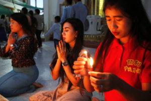 People pray at a pagoda during the Thadingyut festival in Mandalay, Myanmar, October 13, 2019. Photo taken on October 13, 2019. REUTERS/Ann Wang