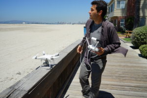 Juliano Calil prepares to launch his drone over Long Beach, Calif., for a virtual reality program he's creating to simulate the effects of sea level rise on the area.