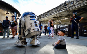 Ronan Chavez, 1, from Arizona, stares at R2D2 as the droid roams around Star Wars Galaxy’s Edge at Disneyland in Anaheim, CA, on Tuesday, Jan. 7, 2020. (Photo by Jeff Gritchen, Orange County Register/SCNG)